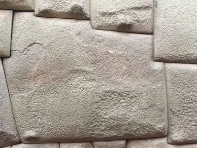 A man attacked the stone with a metal object.