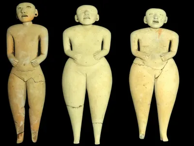 The three larger figurines measure about a foot tall.