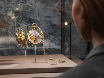 A visitor examines a watch&nbsp;crafted by&nbsp;Abraham-Louis Breguet&nbsp;for Marie Antoinette.