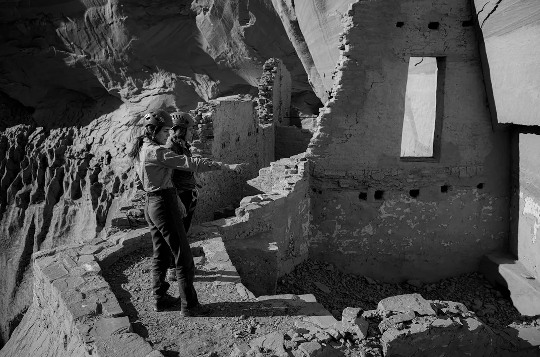 Heather Morrison, left, one of Canyon de Chelly’s archaeologists, and Angelyn Bass stand in one of the complex’s rooms, discussing lidar findings. Bass notes that the room’s doorway is unique for its intact lintels and sills.