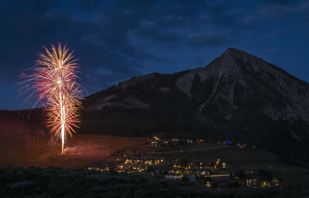 As I returned to my campsite from a day of photographing wildflowers, I discovered an Independence Day fireworks show had started set against the popular Mount Crested Butte.