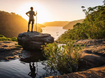 A hiker soaks up the scenery as the sun sets in Ku-Ring-Gai Chase National Park in Sydney.
