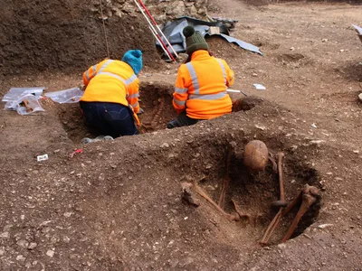 The 13 adults discovered at the site appear to have be positioned in a similar way: seated, with their backs resting against the eastern wall of a pit.