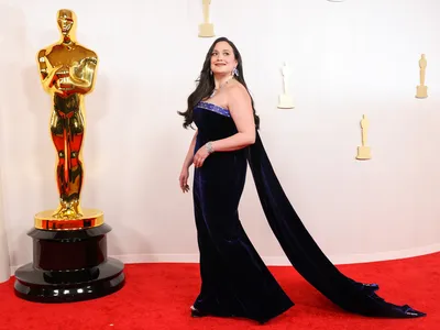 Lily Gladstone poses on the red carpet at the Academy Awards in March 2024.

