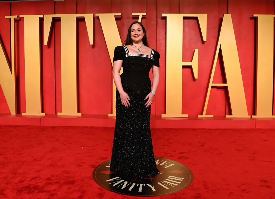 Lily Gladstone in a black gown