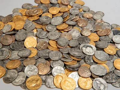 The 404 coins discovered in a muddy field near Bunnik, a village in the Netherlands, in 2023 and 2024
