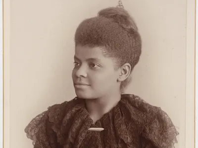 Portrait of Ida B. Wells from the waist up in 3/4th profile.