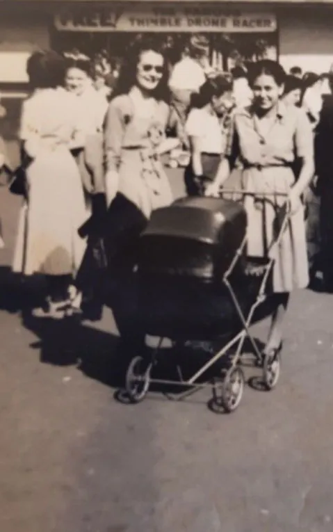Joyce Espe pushes her son, Victor, in a stroller.