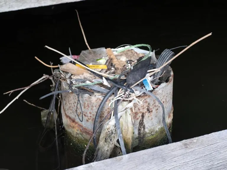 Pile of trash on a concrete pylon