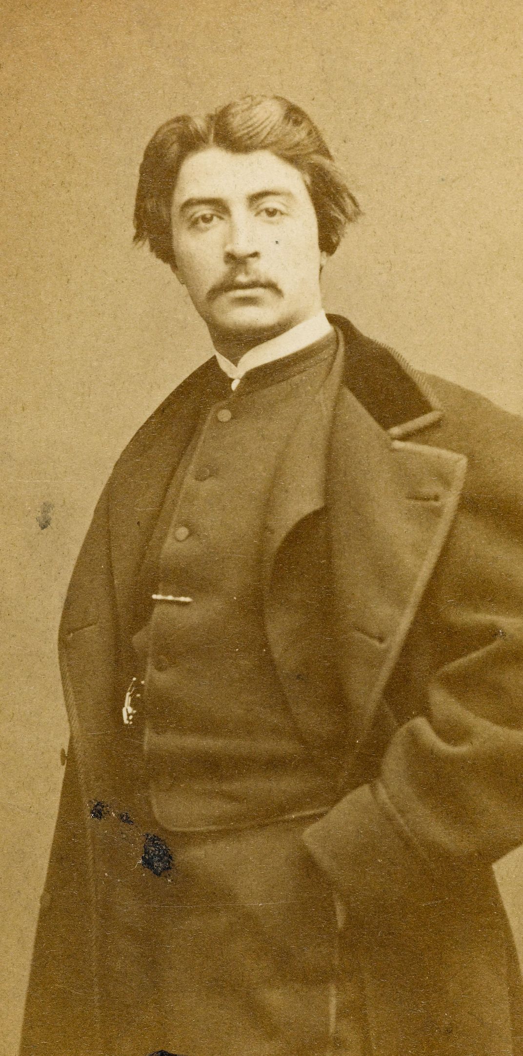 A photograph of the artist James Tissot