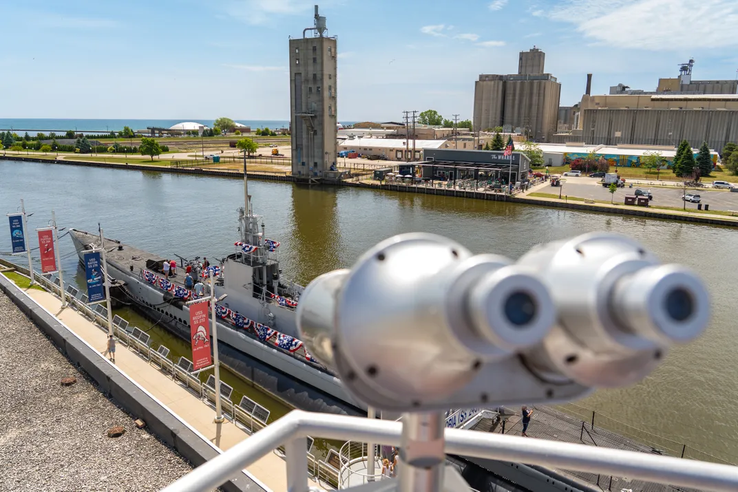 Submarine floating on water in the background, with viewfinder in the foreground