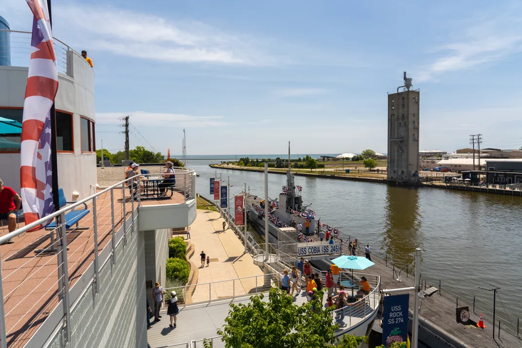 Top of submarine floating on waterway